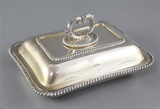 A George V silver entree dish and cover with handle by Mappin & Webb, 52 oz.